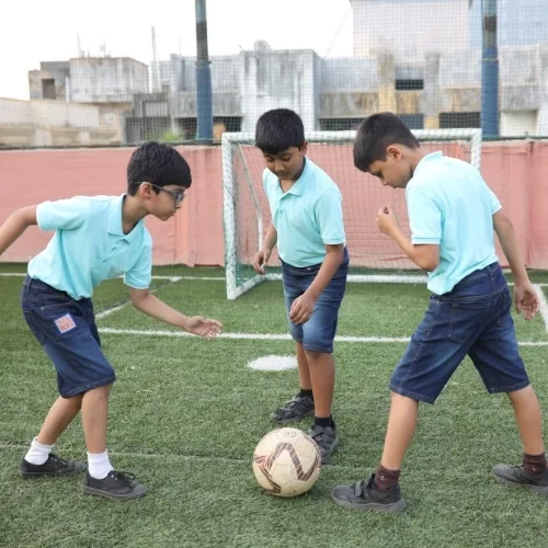 Students playing football at Cresmonde World School, Vikhroli